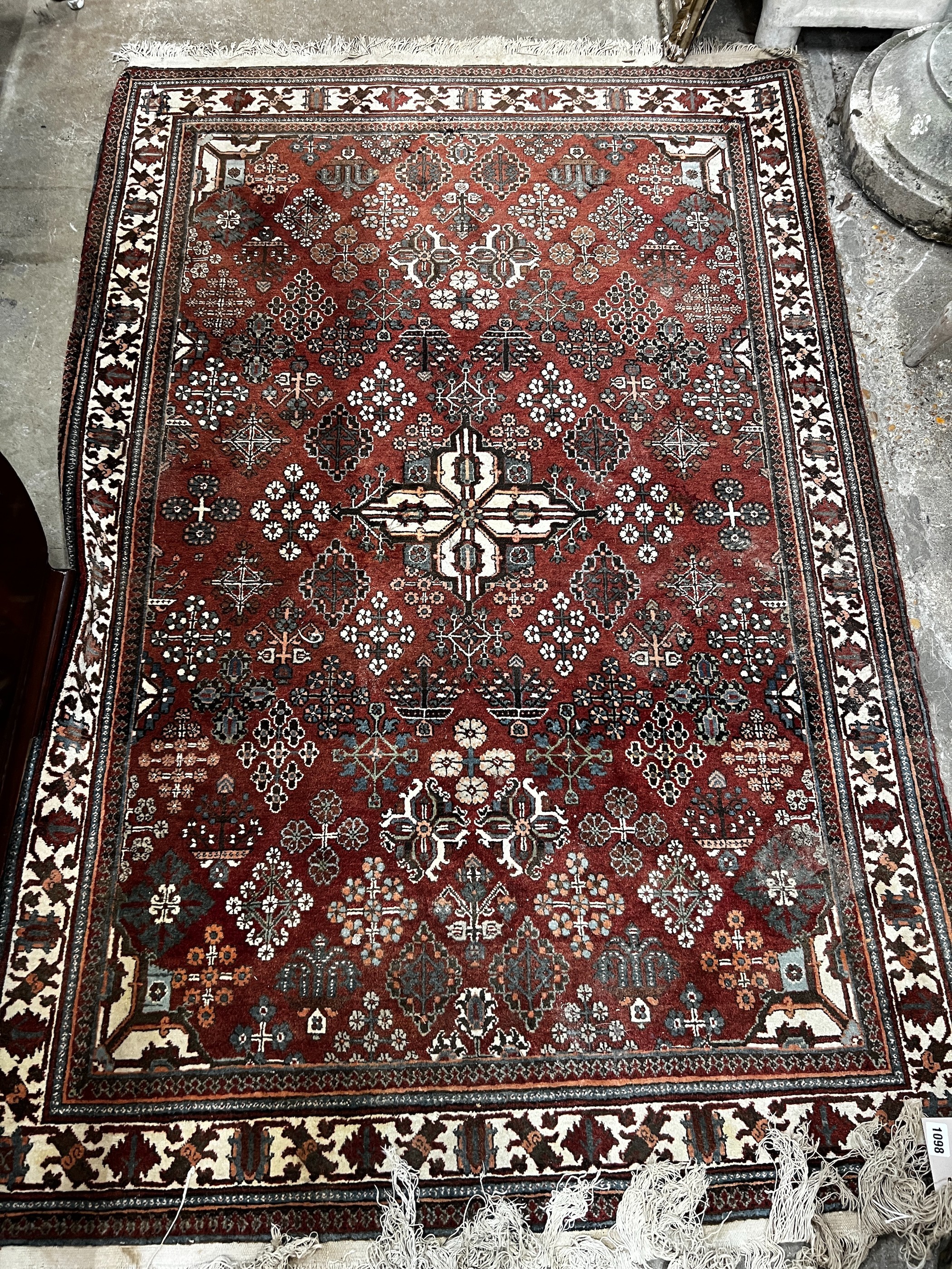 A North West Persian red ground rug, 170 x 116cm